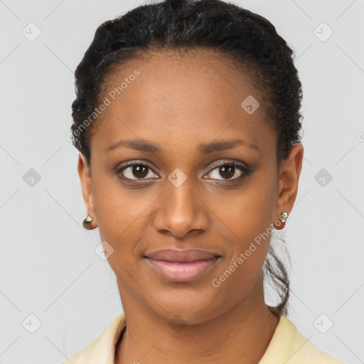 Joyful black young-adult female with short  black hair and brown eyes
