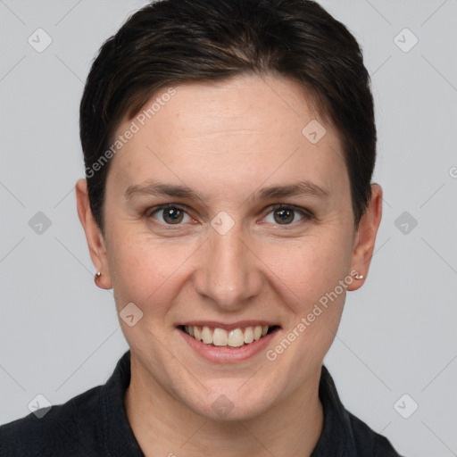 Joyful white young-adult female with short  brown hair and grey eyes