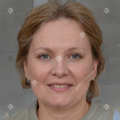 Joyful white adult female with medium  brown hair and blue eyes