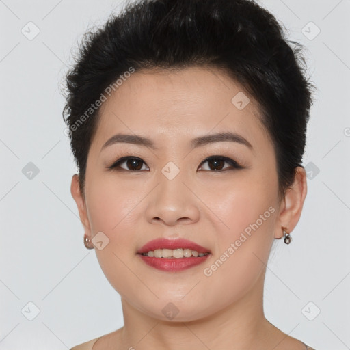 Joyful asian young-adult female with short  brown hair and brown eyes