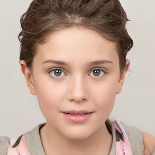 Joyful white child female with short  brown hair and brown eyes