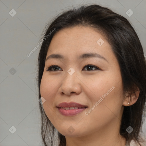 Joyful asian young-adult female with medium  brown hair and brown eyes