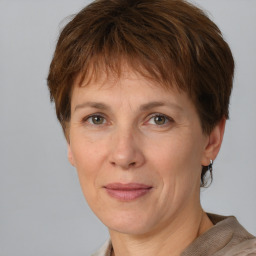 Joyful white adult female with short  brown hair and grey eyes