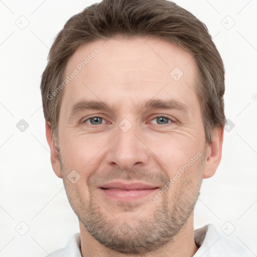 Joyful white adult male with short  brown hair and grey eyes