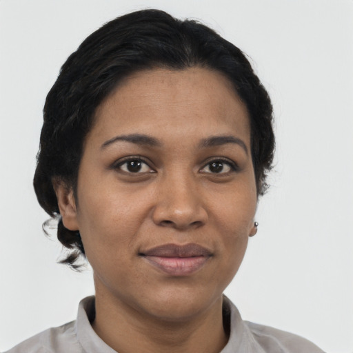 Joyful latino young-adult female with short  brown hair and brown eyes