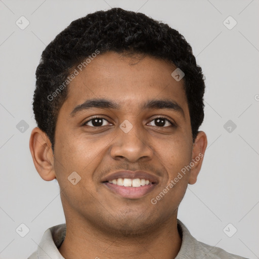 Joyful black young-adult male with short  black hair and brown eyes