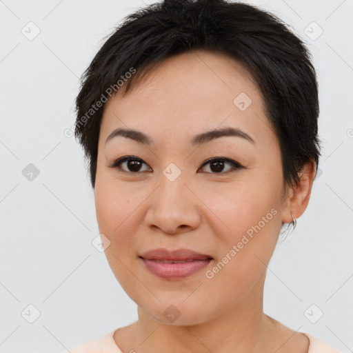 Joyful asian young-adult female with short  brown hair and brown eyes