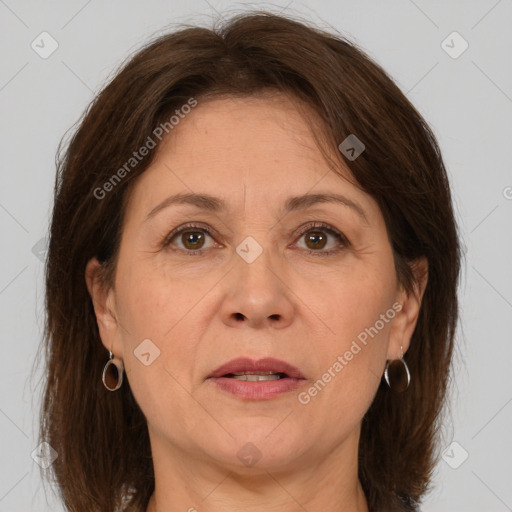 Joyful white adult female with medium  brown hair and brown eyes