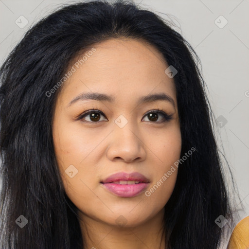 Joyful latino young-adult female with long  black hair and brown eyes