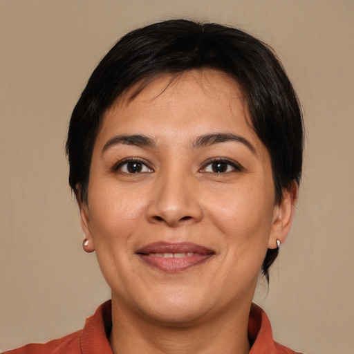 Joyful white adult female with medium  brown hair and brown eyes