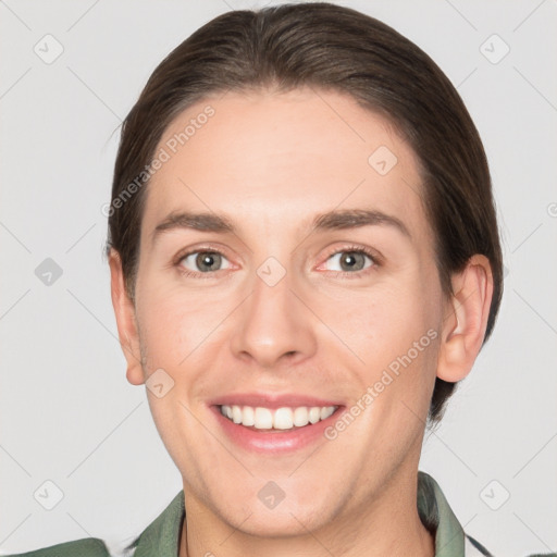 Joyful white young-adult female with short  brown hair and grey eyes