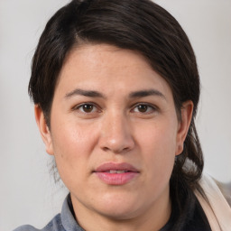 Joyful white adult female with medium  brown hair and brown eyes