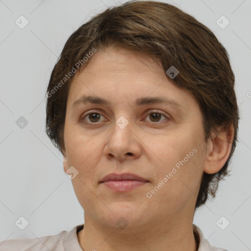 Joyful white adult female with short  brown hair and brown eyes