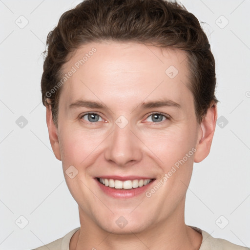 Joyful white young-adult female with short  brown hair and grey eyes