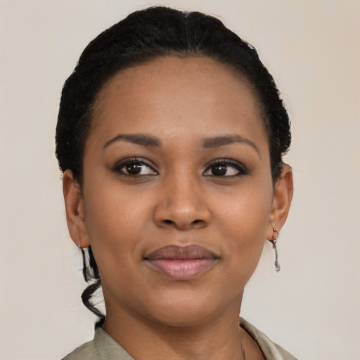 Joyful latino young-adult female with short  black hair and brown eyes