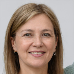Joyful white adult female with long  brown hair and grey eyes