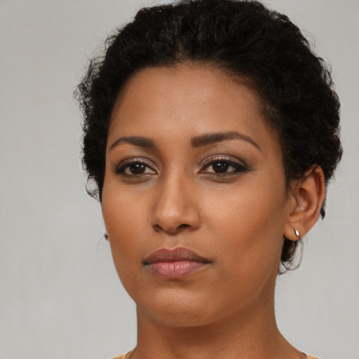 Neutral black young-adult female with short  brown hair and brown eyes
