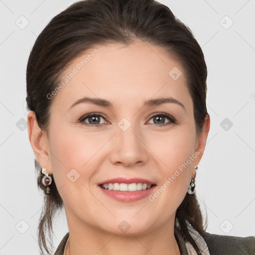 Joyful white young-adult female with medium  brown hair and grey eyes