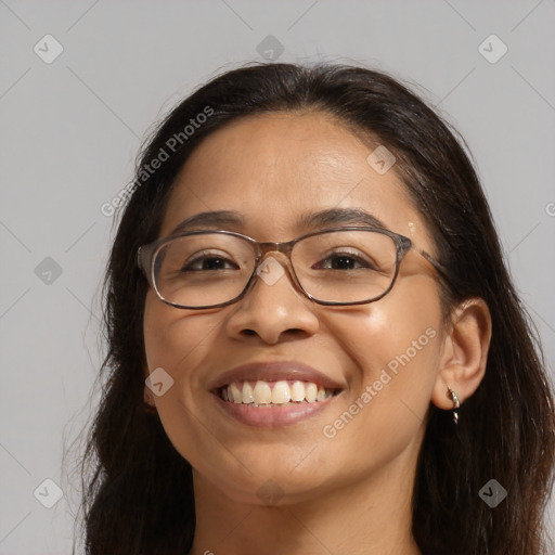 Joyful white adult female with long  brown hair and brown eyes