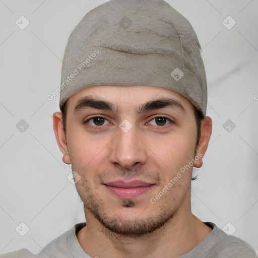 Joyful white young-adult male with short  black hair and brown eyes