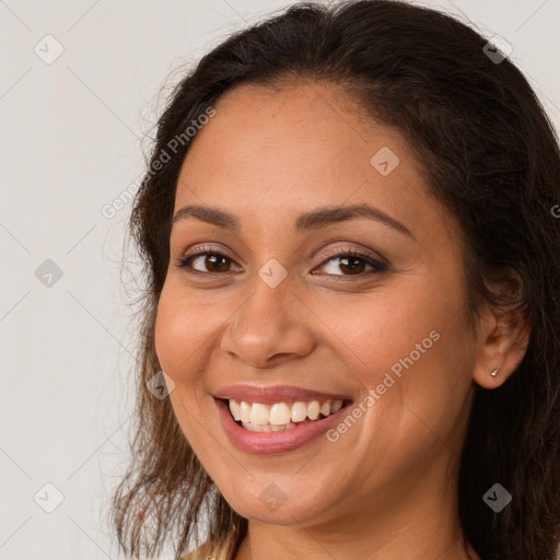 Joyful white young-adult female with long  brown hair and brown eyes