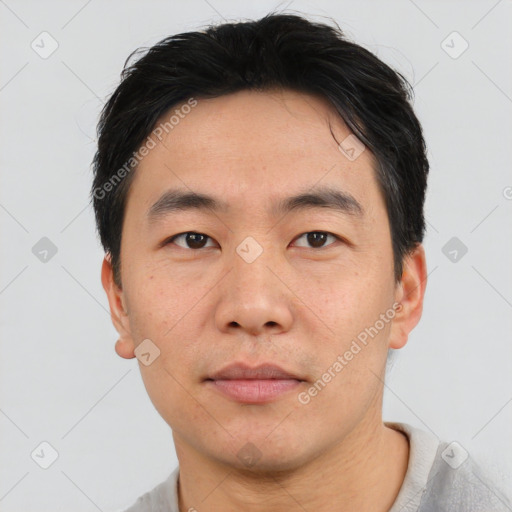 Neutral asian young-adult male with short  brown hair and brown eyes