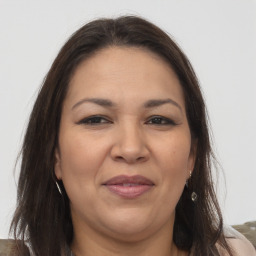 Joyful white adult female with long  brown hair and brown eyes