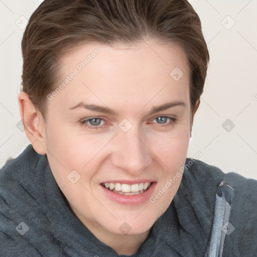 Joyful white young-adult female with short  brown hair and grey eyes