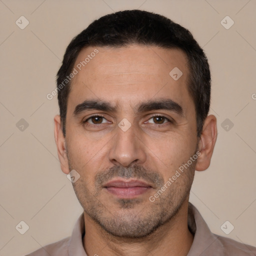 Joyful white young-adult male with short  black hair and brown eyes