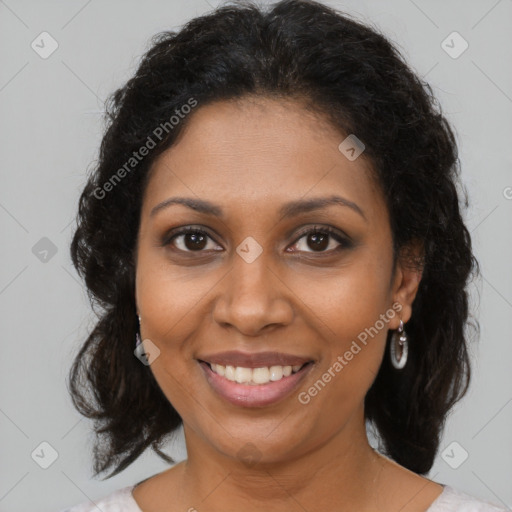 Joyful black young-adult female with medium  brown hair and brown eyes