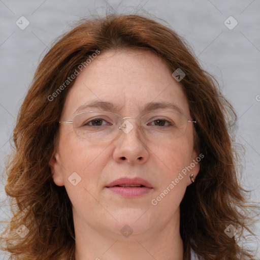 Joyful white adult female with long  brown hair and brown eyes