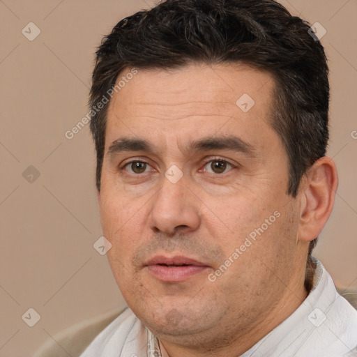 Joyful white adult male with short  brown hair and brown eyes