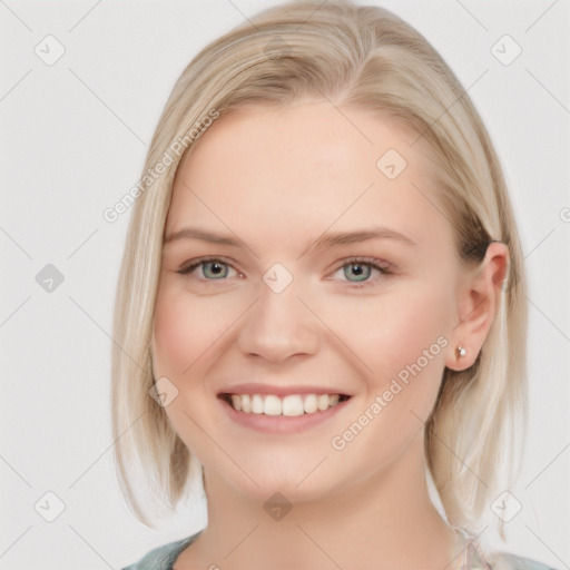 Joyful white young-adult female with medium  brown hair and blue eyes