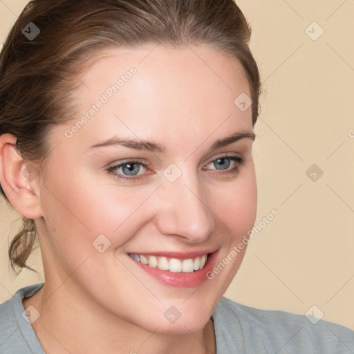 Joyful white young-adult female with long  brown hair and blue eyes