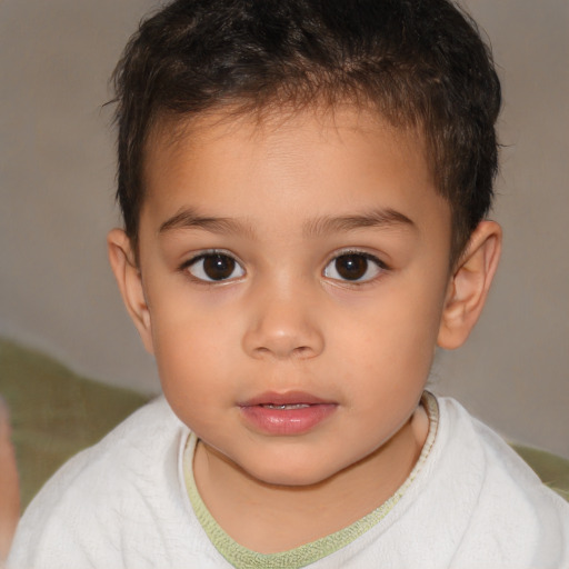 Joyful white child male with short  brown hair and brown eyes