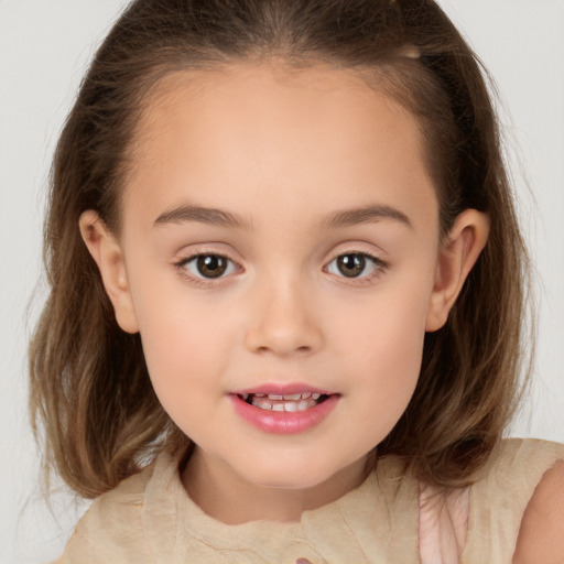 Joyful white child female with medium  brown hair and brown eyes