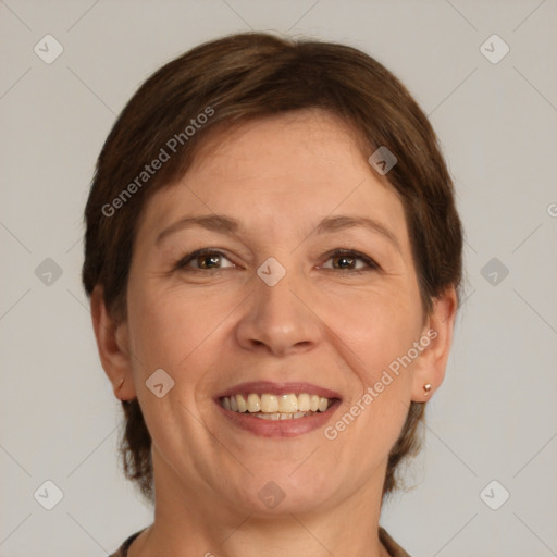 Joyful white adult female with short  brown hair and brown eyes