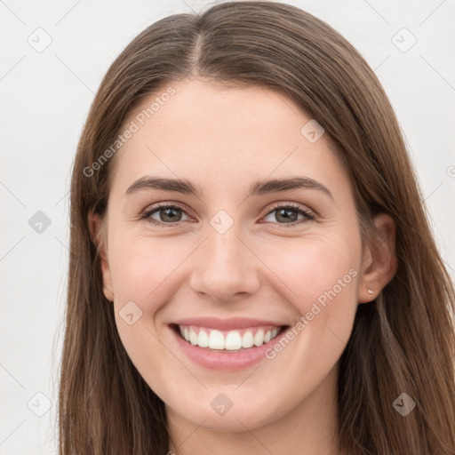 Joyful white young-adult female with long  brown hair and grey eyes