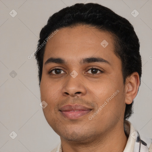 Joyful latino young-adult male with short  black hair and brown eyes