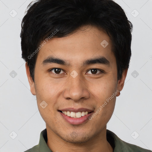 Joyful asian young-adult male with short  brown hair and brown eyes