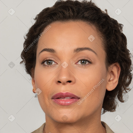 Joyful white adult female with short  brown hair and brown eyes