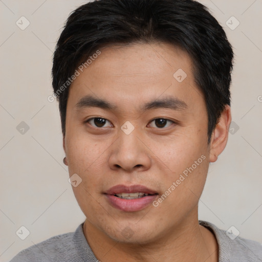 Joyful white young-adult male with short  black hair and brown eyes