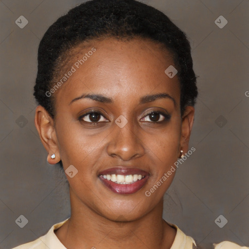 Joyful black young-adult female with short  brown hair and brown eyes