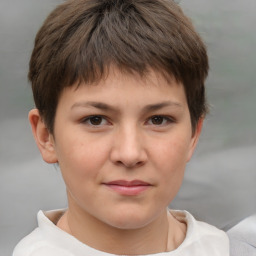 Joyful white child female with short  brown hair and brown eyes