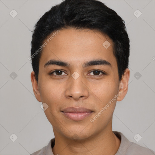 Joyful latino young-adult male with short  black hair and brown eyes