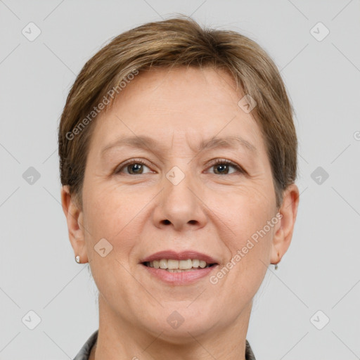 Joyful white adult female with short  brown hair and grey eyes