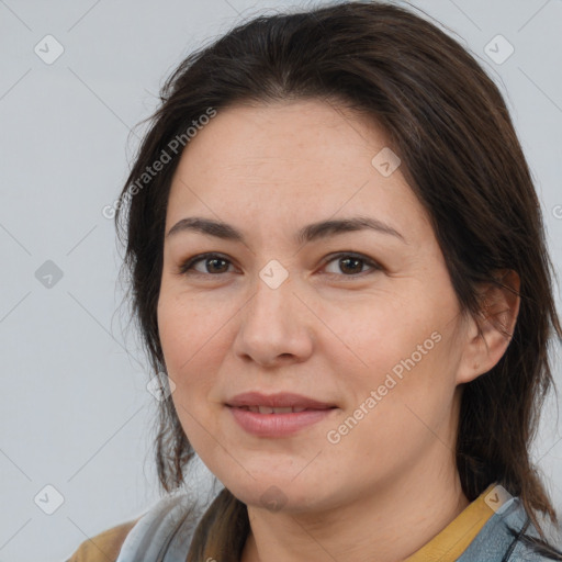 Joyful white adult female with medium  brown hair and brown eyes