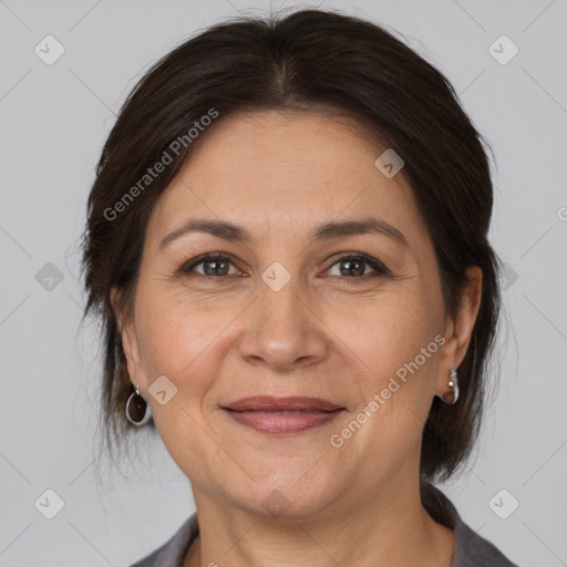 Joyful white adult female with medium  brown hair and brown eyes