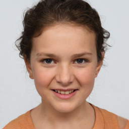 Joyful white child female with short  brown hair and brown eyes