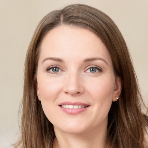 Joyful white young-adult female with long  brown hair and grey eyes